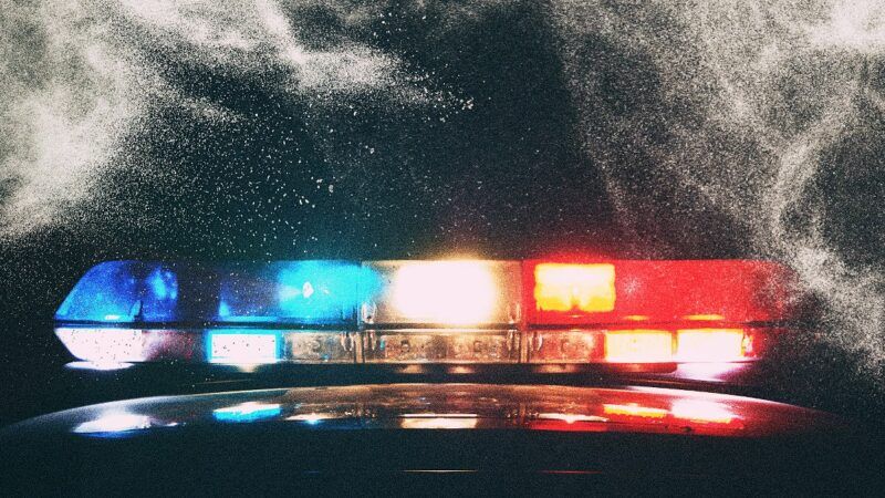 Flashing police car lights and white powder