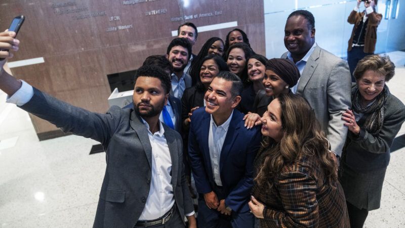 Members of Congress taking a group selfie