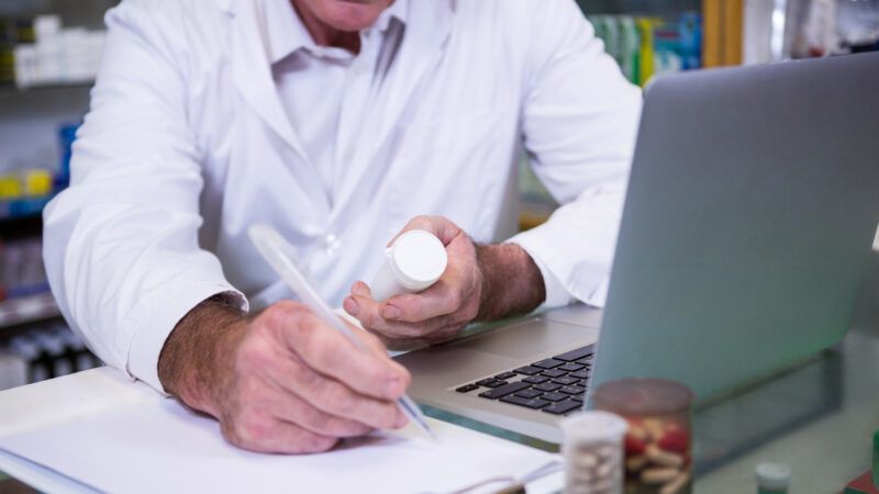 Doctor writing a prescription for pain medicine | Photo 77225536 © Wavebreakmedia Ltd | Dreamstime.com