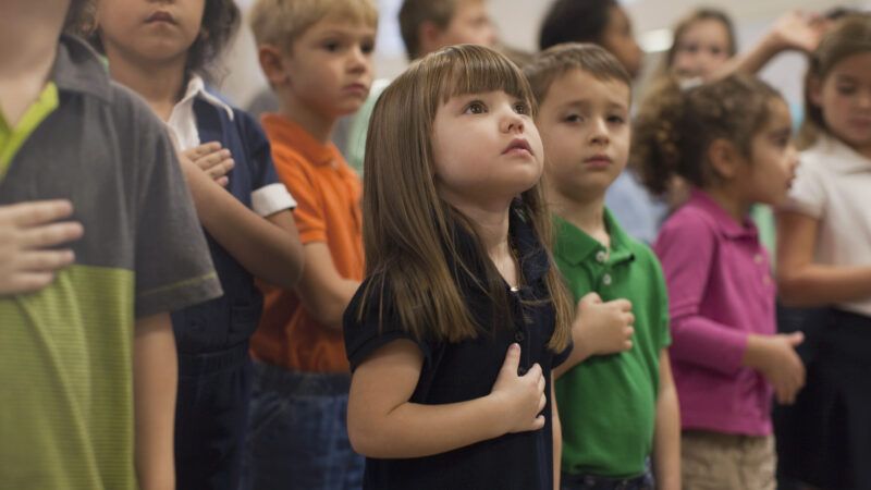 Children reciting the pledge of allegiance.