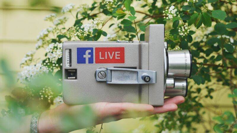 Camera with Facebook and "Live" stickers on it