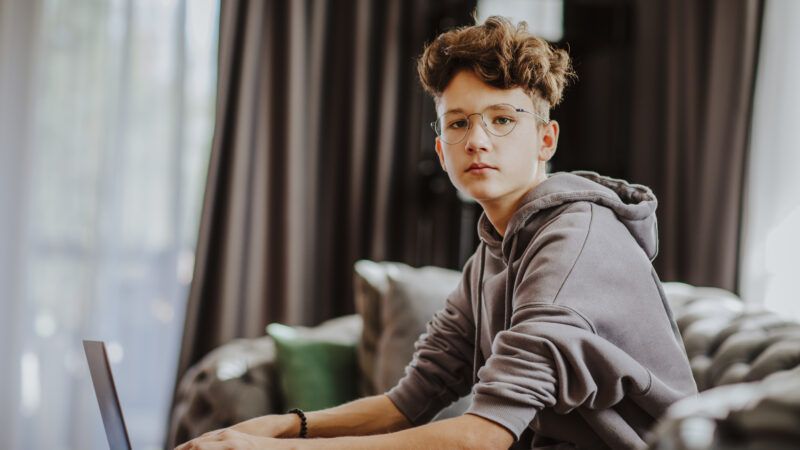 teenage boy at a laptop