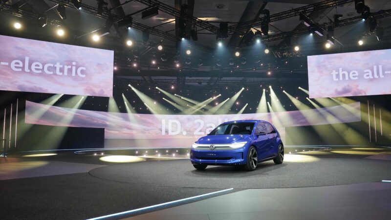 Volkswagen's ID.2all electric hatchback concept car sits onstage at an event in Hamburg, Germany. | Marcus Brandt/dpa/picture-alliance/Newscom