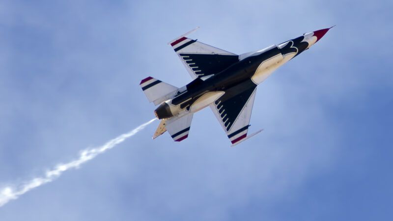 A U.S. Air Force F-16 jet flying as part of a Thunderbirds show.