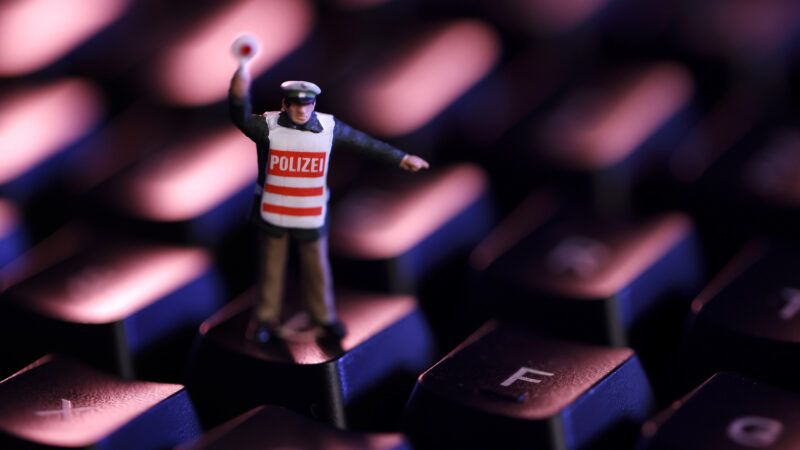 tiny cop standing on computer keyboard | Future Image/ZUMAPRESS/Newscom