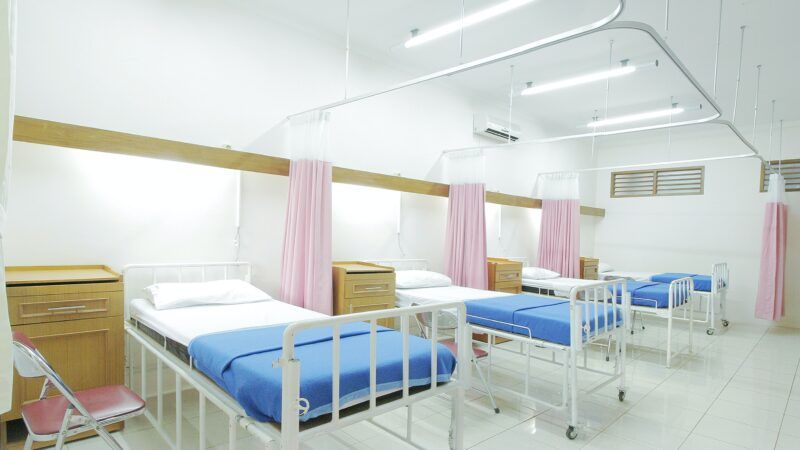 empty hospital beds | Photo by <a href="https://unsplash.com/@adhy?utm_source=unsplash&utm_medium=referral&utm_content=creditCopyText">Adhy Savala</a> on <a href="https://unsplash.com/photos/zbpgmGe27p8?utm_source=unsplash&utm_medium=referral&utm_content=creditCopyText">Unsplash</a>   