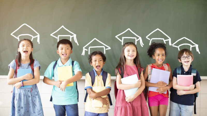 Students in front of a chalk board