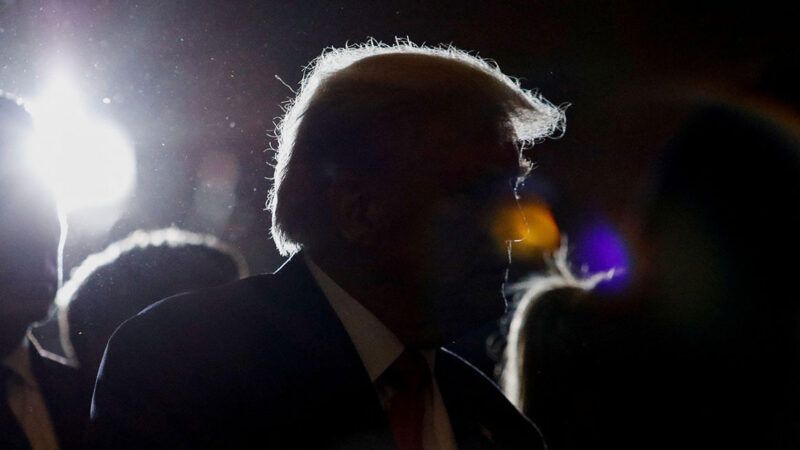 topicspolitics | Photo: Former President Donald Trump greets people ahead of delivering remarks on the day of his court appearance in New York after being indicted by a Manhattan grand jury, April 4, 2023; Reuters/Alamy