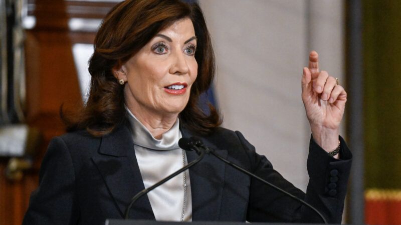 New York Gov. Kathy Hochul addresses a crowd from a lectern.