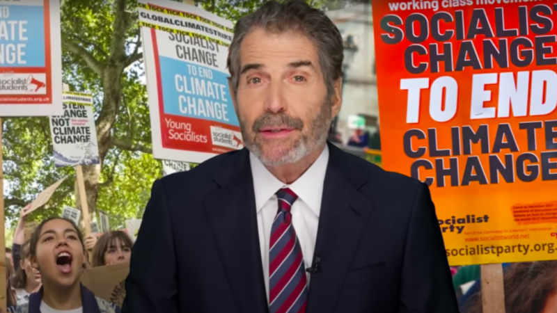 John Stossel stands in front of protest signs for socialist solutions to climate change | Stossel TV