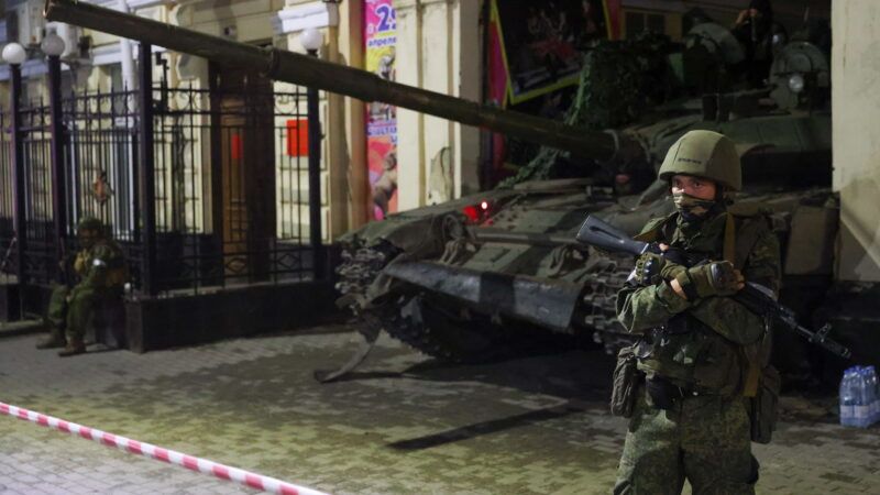 A Wagner Group fighter next to a tank outside a Russian military facility. | Erik Romanenko/ZUMAPRESS/Newscom