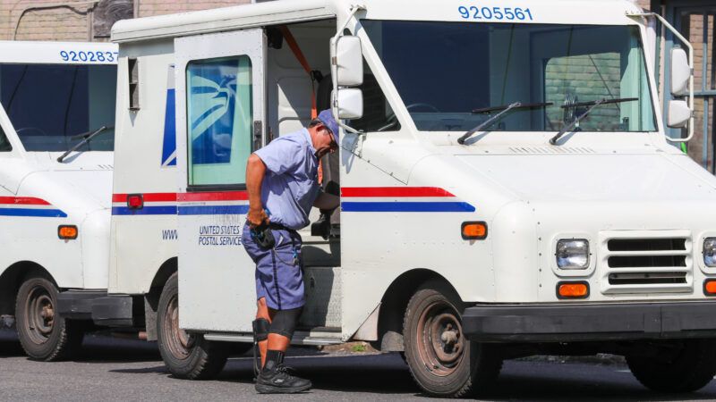 U.S. Postal Service truck and worker