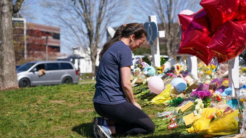 A woman mourns at the Covenant School in Nashville after a mass shooting.