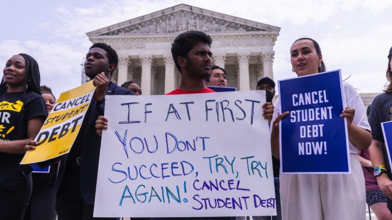 Protesters stand outside the U.S. Supreme Court building with signs calling for President Biden to continue trying to cancel student loan debt. | CNP/AdMedia/Newscom