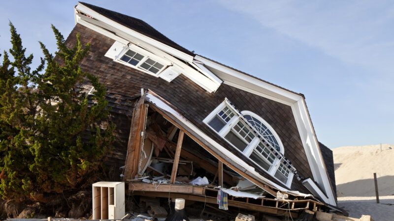 A house collapsed onto one side as a result of damage from Hurricane Sandy. | Anthony Aneese Totah Jr | Dreamstime.com