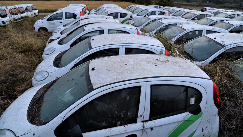 A field full of abandoned electric vehicles in China's Zhejiang province, in November 2019. | Imagine China/Newscom