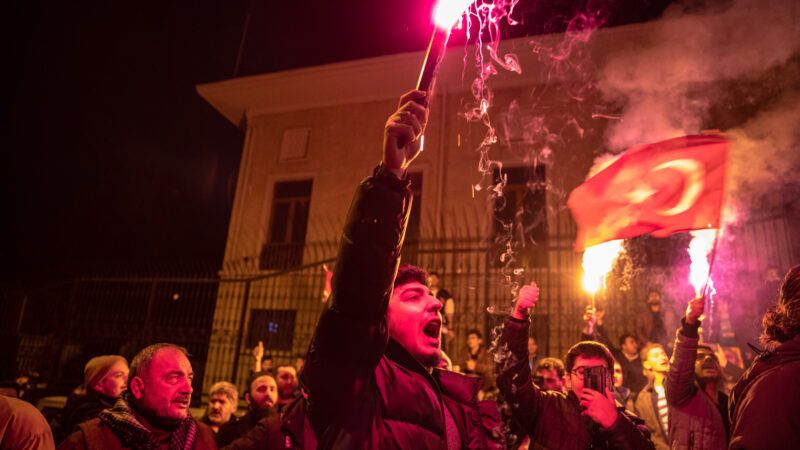 Protesters hold lit torches during the demonstration. After Rasmus Paludan, the leader of the far-right political party Hard Line in Denmark and also a Swedish citizen, burning the Holy Quran near the Turkish Embassy in Stockholm, Anatolian Youth Association (AGD) and National Youth Foundation (MGV) members and supporting citizens held a demonstration near the Swedish Consulate in Beyoglu, Istanbul. | Onur Dogman / SOPA Images/Sipa U/Newscom