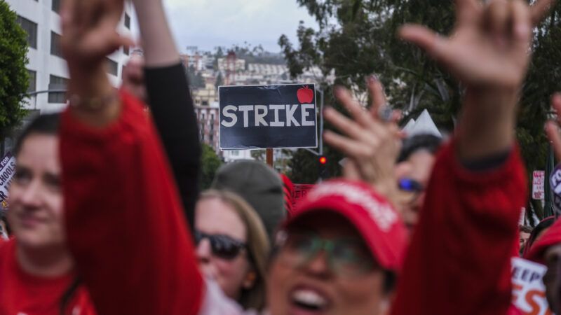 Protesters and sign from a strike | Ringo Chiu/ZUMAPRESS/Newscom