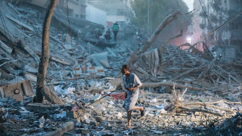 A lone person walks atop rubble in the wake of the war in Israel and Palestine | Apaimages/SIPA/Newscom