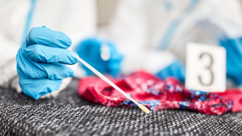 A forensic scientist takes a DNA sample. | Robert Kneschke | Dreamstime.com