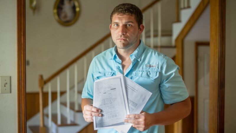 Waylon Bailey holds papers | Institute for Justice