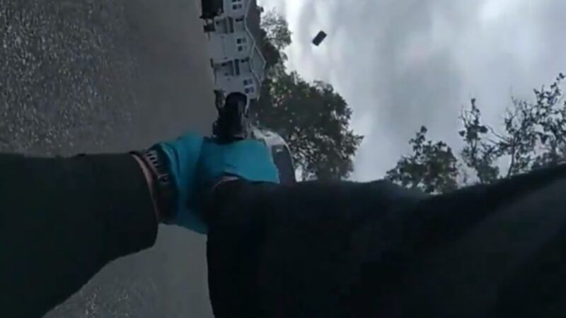 A screenshot from body camera footage shows a Florida sheriff's deputy firing at his own patrol car | Okaloosa County Sheriff’s Office 