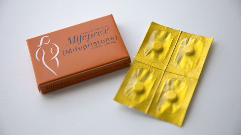 Mifepristone pills next to their box against a gray background |  Erin Hooley/TNS/Newscom
