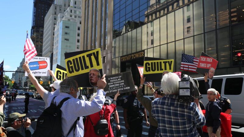 A crowd of protesters stands outside Trump Tower in Manhattan, holding signs that say GUILTY | CHINE NOUVELLE/SIPA/Newscom