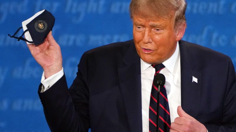 Donald Trump holding a mask during a presidential debate | KEVIN DIETSCH/UPI/Newscom