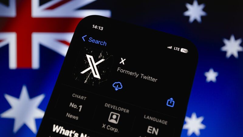 An Apple iPhone open to the App Store listing for X (formerly Twitter), against the backdrop of the Australian flag. | Andre M. Chang/ZUMAPRESS/Newscom