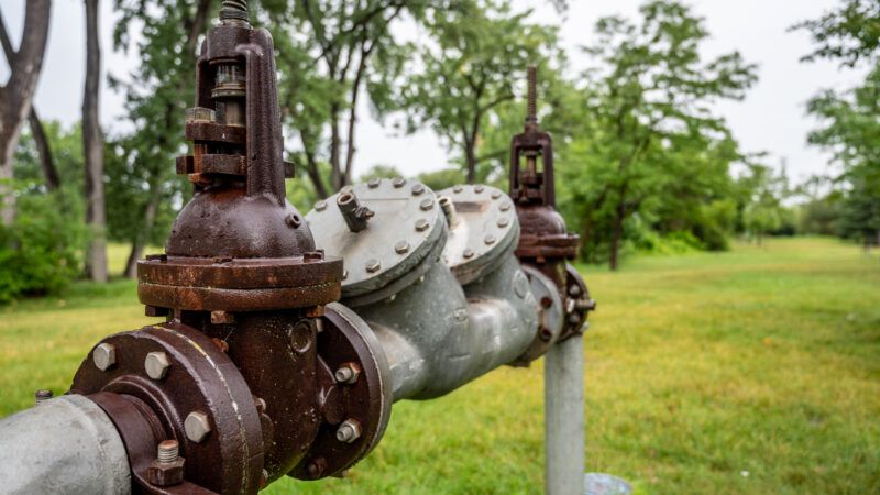 Water main, pipes with backflow preventer. | Stevendalewhite | Dreamstime.com