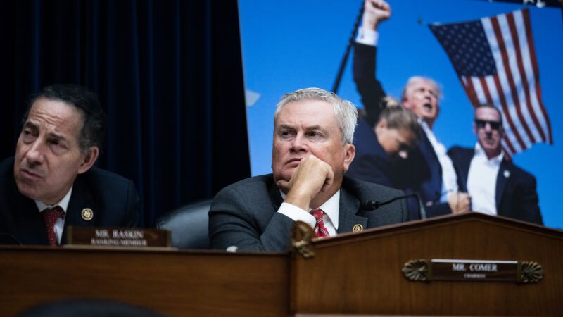 Reps. James Comer (R–Ky.) and Jamie Raskin (D–Md.) preside over the House Oversight Committee, with a large picture of former President Donald Trump in the background, pumping his fist in the air after his assassination attempt. | Tom Williams/CQ Roll Call/Newscom