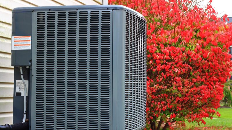 An outdoor residential air conditioning unit. | Luckydoor | Dreamstime.com 