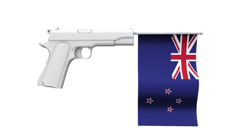 A white handgun with a New Zealand flag sticking out of the barrel, like in a cartoon where the gun doesn't fire. | DPST/Newscom