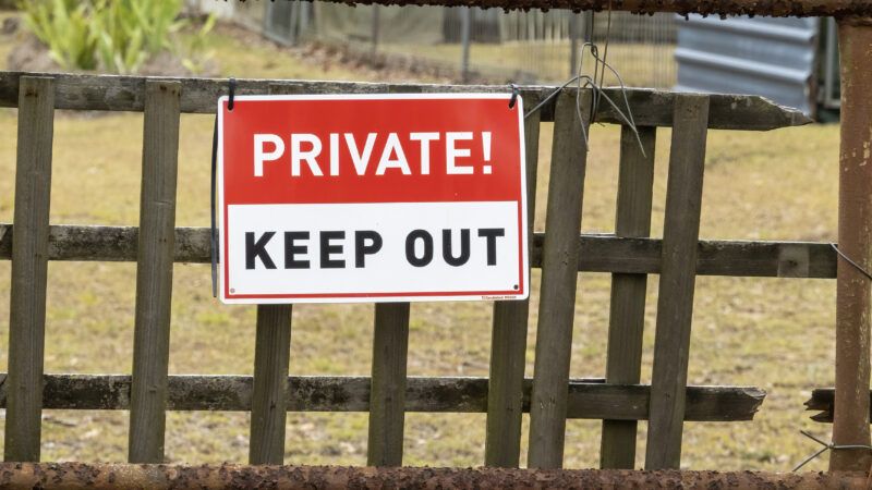 A farm fence with a red and white sign reading PRIVATE! KEEP OUT | Michele Jackson | Dreamstime.com