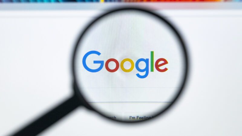 The Google logo is seen underneath a magnifying glass | ID 104313256 © Bigtunaonline | Dreamstime.com