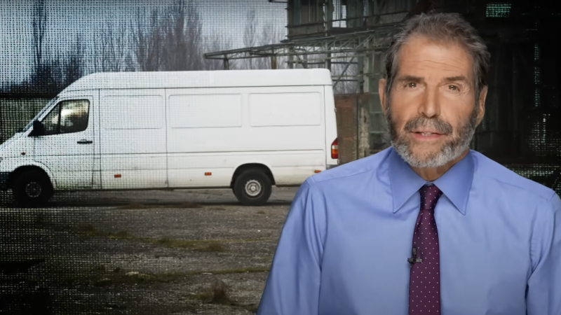 John Stossel is seen next to a white van | Stossel TV