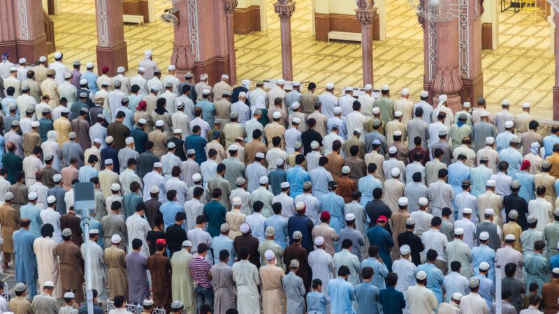 A crowd of worshipers at the Sunehri Mosque in Peshawar, Pakistan | Shahid Khan | Dreamstime.com