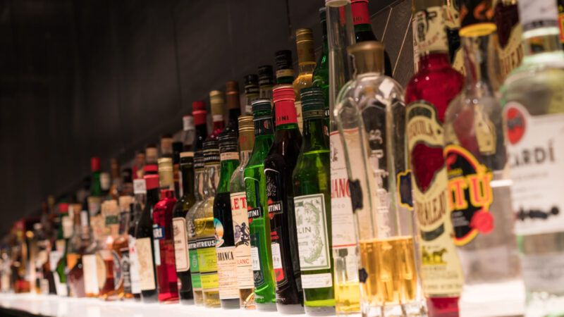 Bottles of liquor on a bar shelf | Dreamstime