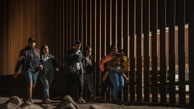 Migrants walk along the U.S.-Mexico border in Yuma, Arizona | weizhong qian/Qian Weizhong/VCG/Newscom