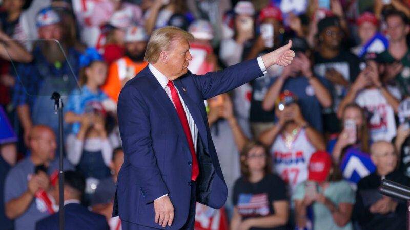 Trump speaks to a crowd of people seated on risers | : Josh Brown/ZUMAPRESS/Newscom