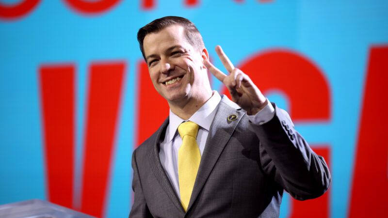 Libertarian Party presidential candidate Chase Oliver flashes a peace sign from the stage at FreedomFest 2024. | Gage Skidmore/ZUMAPRESS/Newscom