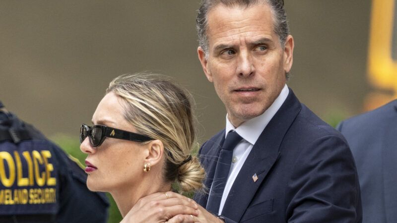 Hunter Biden holds a woman's shoulder as he looks to the side | Credit: KEN CEDENO/UPI/Newscom