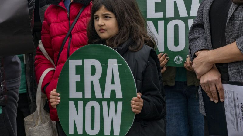 Demonstrator holding 'ERA Now' sign | Sue Dorfman/ZUMAPRESS/Newscom