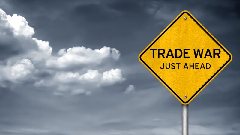 Road sign saying "Trade war just ahead" | ID 119107442 © Waingro | Dreamstime.com