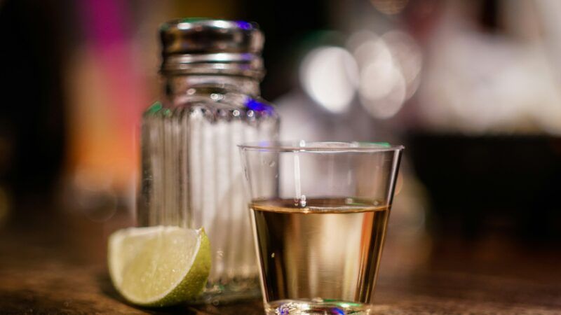 A shot of tequila with a lime and salt | Photo by Francisco Galarza on Unsplash