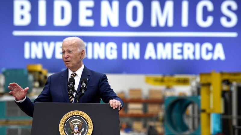 President Joe Biden in front of a banner that reads "Bidenomics: Investing in America" | Mark Hertzberg/ZUMAPRESS/Newscom