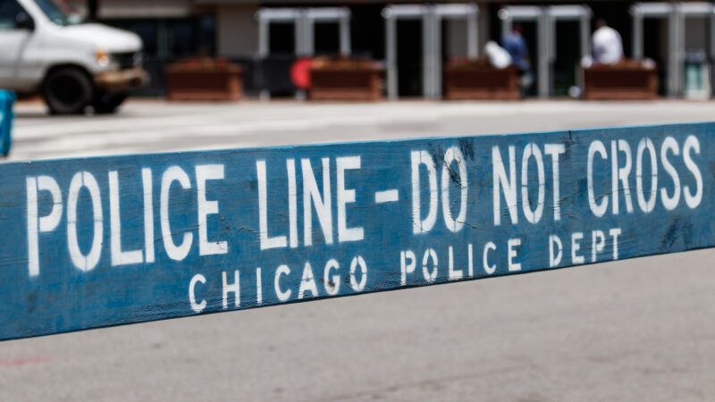 A piece of blue tape stretches across a parking lot and reads in white letters: Police Line - Do Not Cross. Chicago Police Dept" | ID 151790634 © Jonathan Weiss | Dreamstime.com