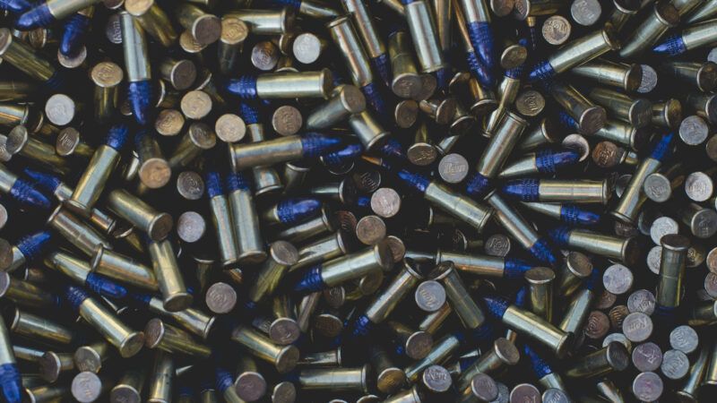 Close-up view of a bunch of bullets loose in a container. | Bricbricanderson | Dreamstime.com