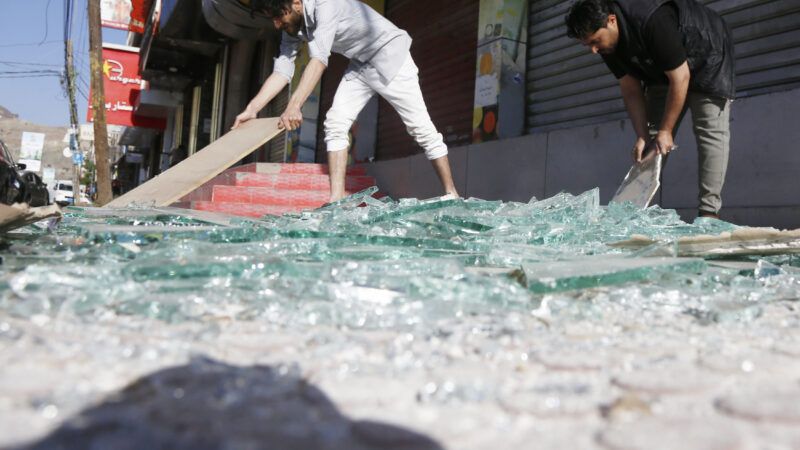 Residents clean broken glass on a street after U.S. overnight airstrikes in Sanaa, Yemen, on March 16, 2025. | Mohammed / Xinhua News Agency/Newscom